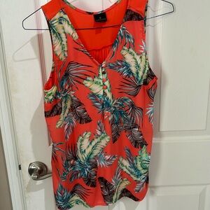 Size medium orange mixed media sleeveless top. Button detail on the front.